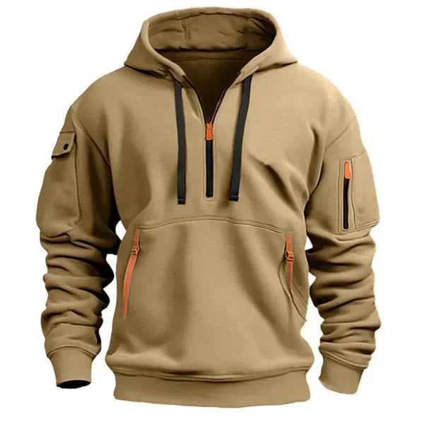 Tan hoodie with black and orange zippers on a white background